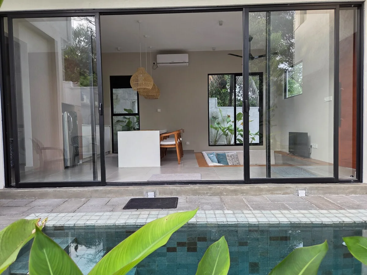 Villa 115 plunge pool opening onto the living and dining spaces